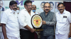 Justice N. Nagaresh presenting the shield of appreciation to Dr. Junaid Rahman